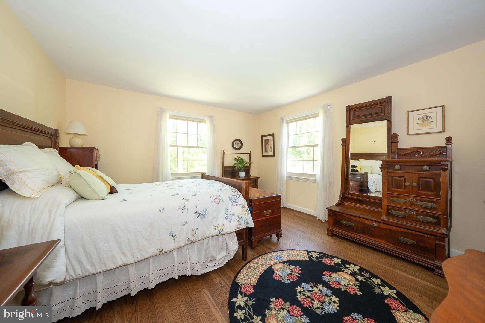 658 Conestoga Road Villanova, PA 19085 - Photo 36 of 57 a bedroom with a bed and wooden floor