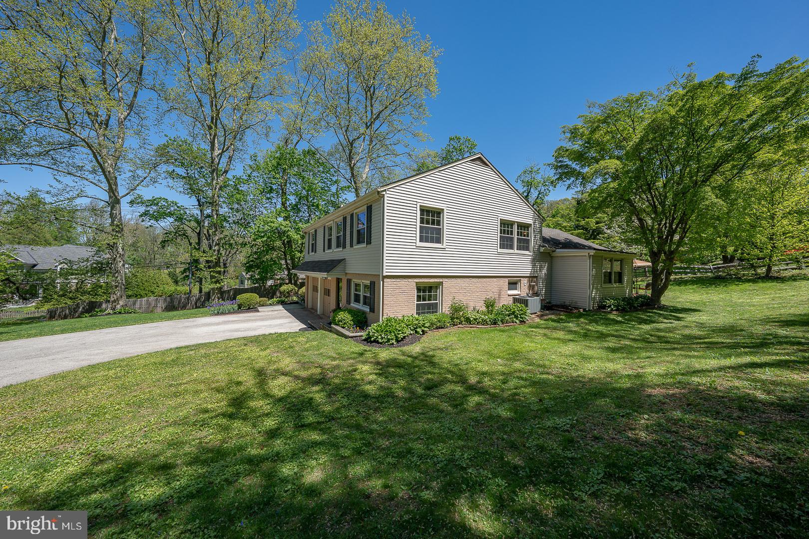 658 Conestoga Road Villanova, PA 19085 - Photo 50 of 57 a view of a house with a big yard and large tree