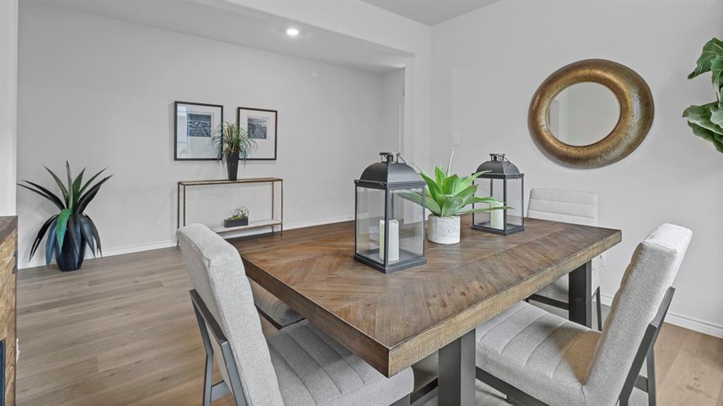 2000 Foggy Wds Lane Anna, TX 75409 - Photo 13 of 40 a view of a dining room with furniture and a potted plant