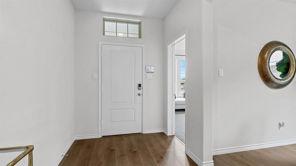 2000 Foggy Wds Lane Anna, TX 75409 - Photo 14 of 40 a view of a livingroom with wooden floor