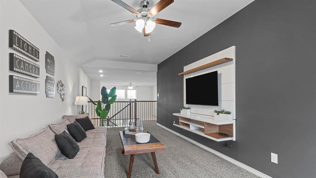 2000 Foggy Wds Lane Anna, TX 75409 - Photo 17 of 40 a living room with furniture and a flat screen tv