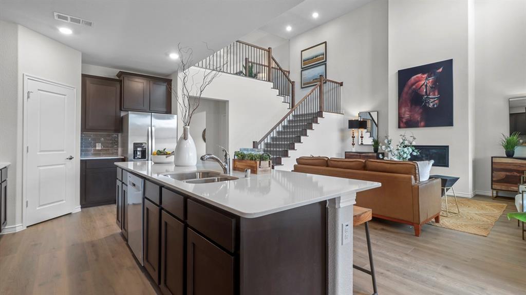 2000 Foggy Wds Lane Anna, TX 75409 - Photo 20 of 40 a kitchen with a sink a counter top space and stainless steel appliances