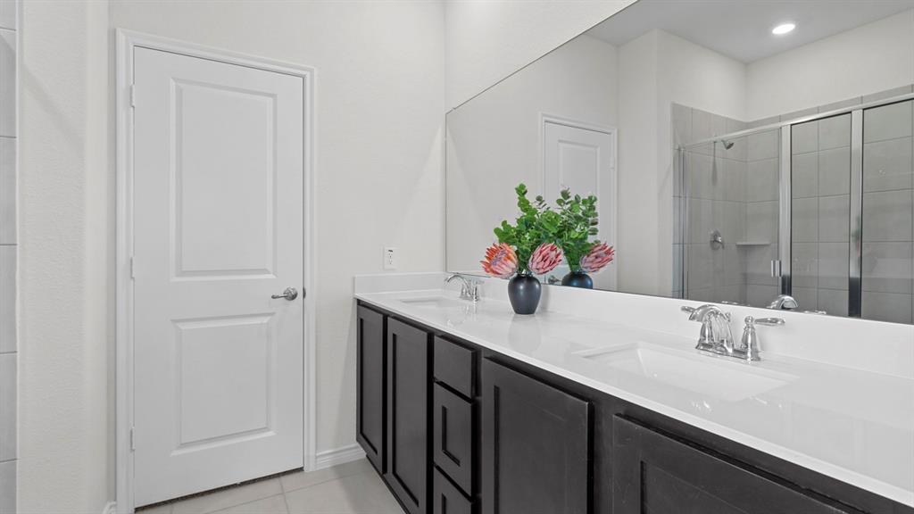 2000 Foggy Wds Lane Anna, TX 75409 - Photo 25 of 40 a bathroom with a sink and a mirror