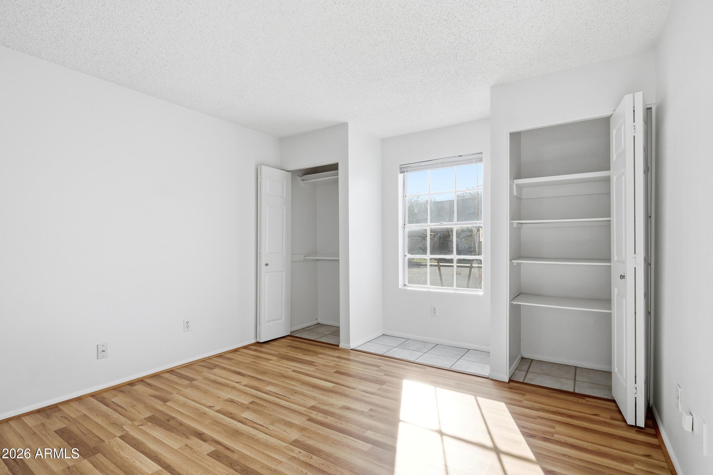 1033 East Bendix Drive Tempe, AZ 85283 - Photo 17 of 31 a view of empty room with wooden floor and fan