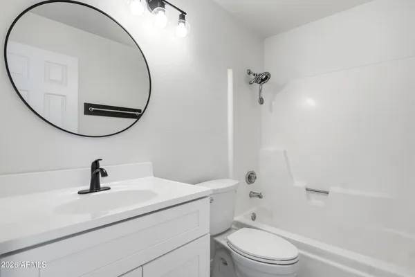 a view of storage and utility room with washer and dryer