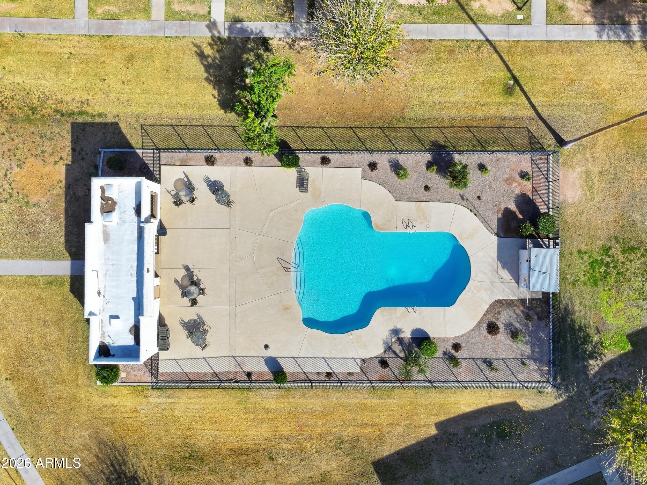 1033 East Bendix Drive Tempe, AZ 85283 - Photo 28 of 31 a view of a swimming pool with a yard
