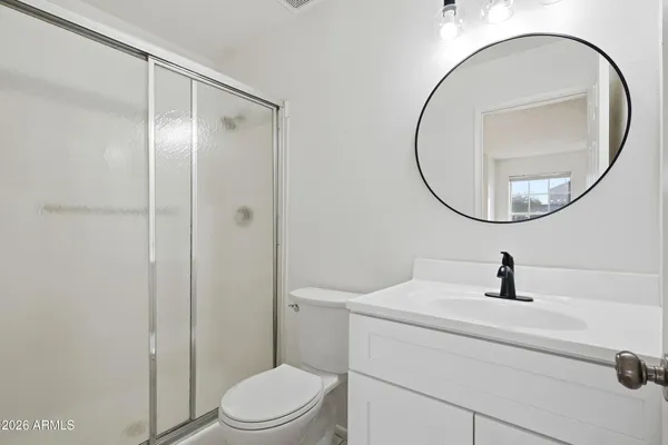 a kitchen that has a sink and a stove in it