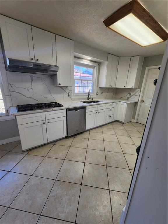 3258 Old Salem Road Southeast Conyers, GA 30013 - Photo 19 of 38 a kitchen with a sink a stove a microwave and cabinets