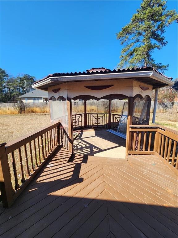 3258 Old Salem Road Southeast Conyers, GA 30013 - Photo 20 of 38 a view of a house with wooden deck