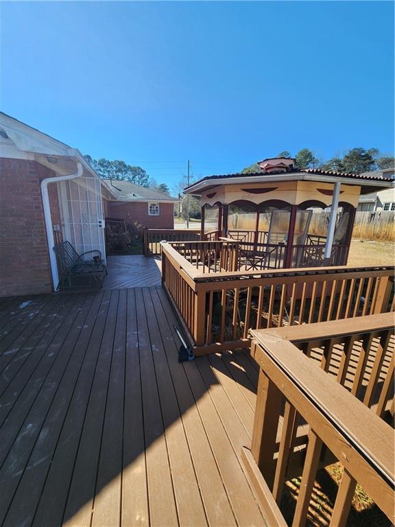3258 Old Salem Road Southeast Conyers, GA 30013 - Photo 22 of 38 a view of a roof deck with wooden floor and fence