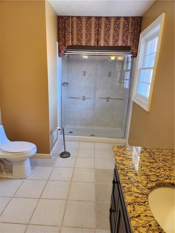 3258 Old Salem Road Southeast Conyers, GA 30013 - Photo 24 of 38 a bathroom with a granite countertop bathtub and toilet