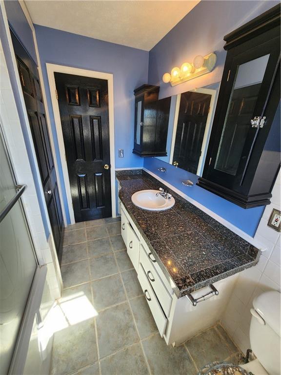 3258 Old Salem Road Southeast Conyers, GA 30013 - Photo 25 of 38 a living room with stainless steel appliances furniture a rug and a mirror