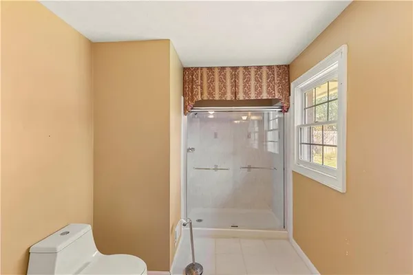 a kitchen with granite countertop a sink stove and refrigerator