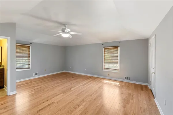 a bathroom with a glass shower door