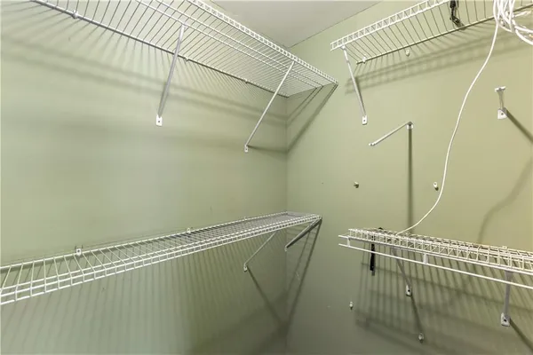 a living room with a fireplace and a window