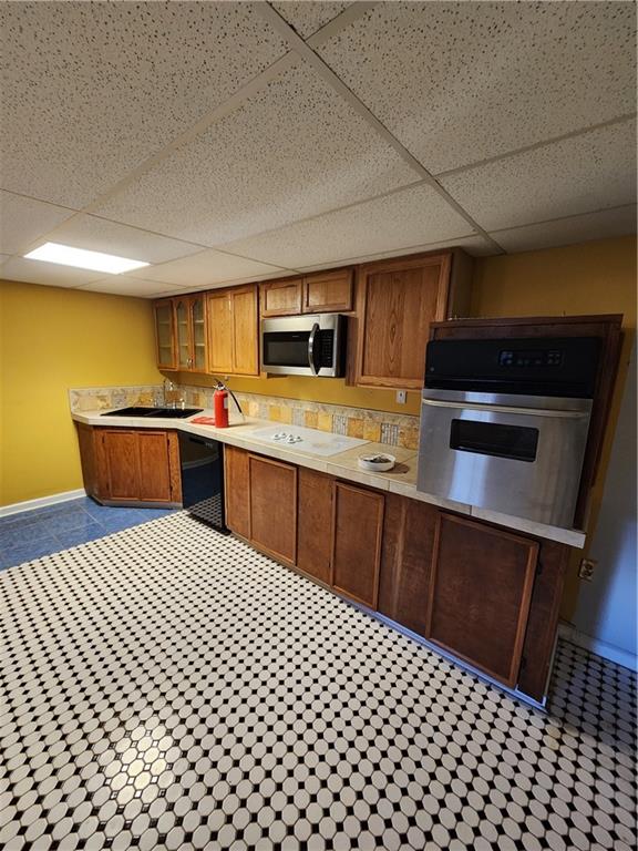 3258 Old Salem Road Southeast Conyers, GA 30013 - Photo 8 of 38 a kitchen with stainless steel appliances a sink a stove top oven a chimney and a refrigerator