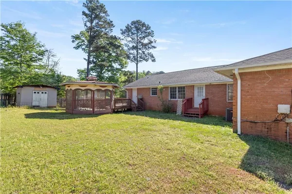 a view of balcony with wooden floor and seating space