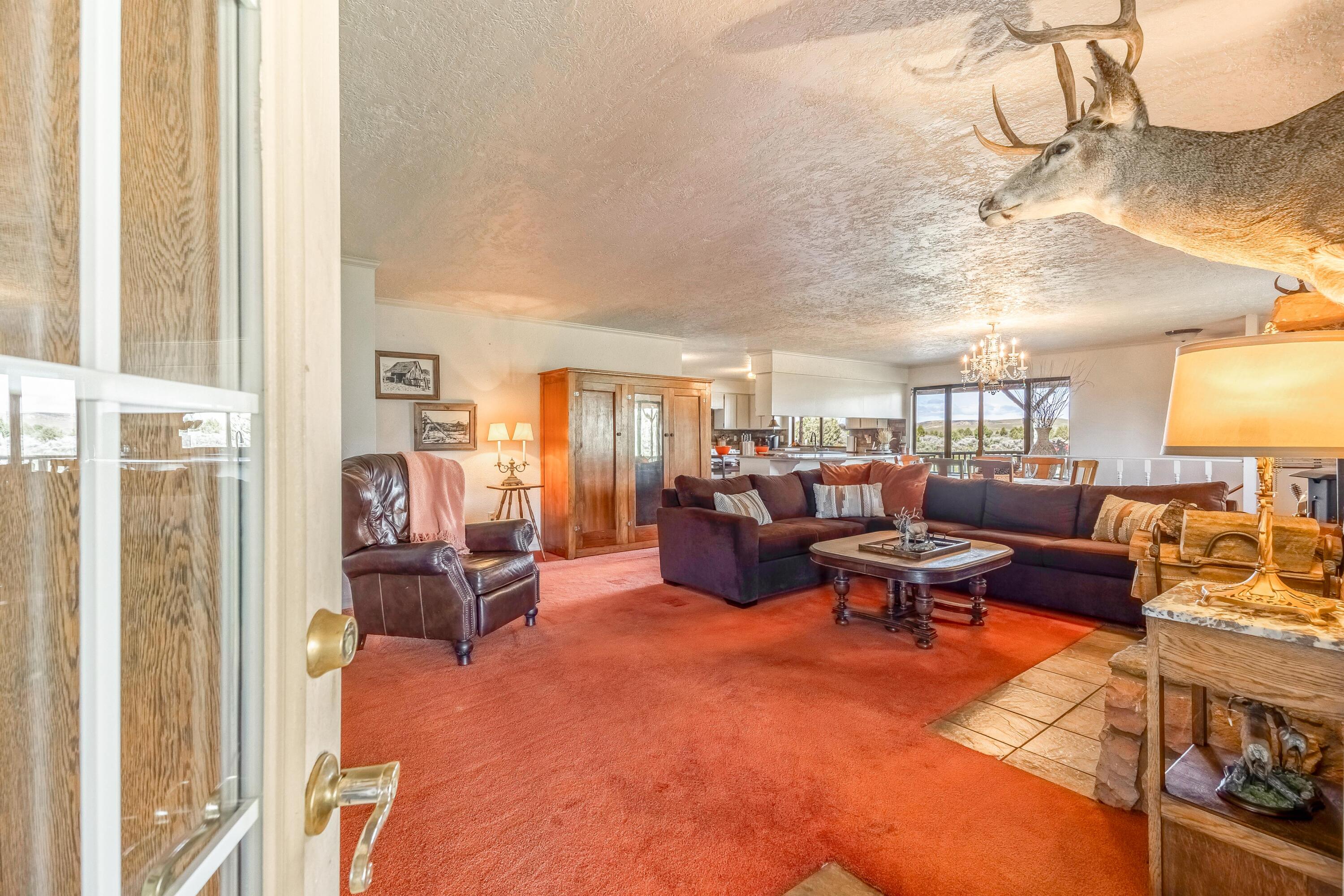 25887 Weberg Road Paulina, OR 97751 - Photo 3 of 46 a living room with furniture and a chandelier