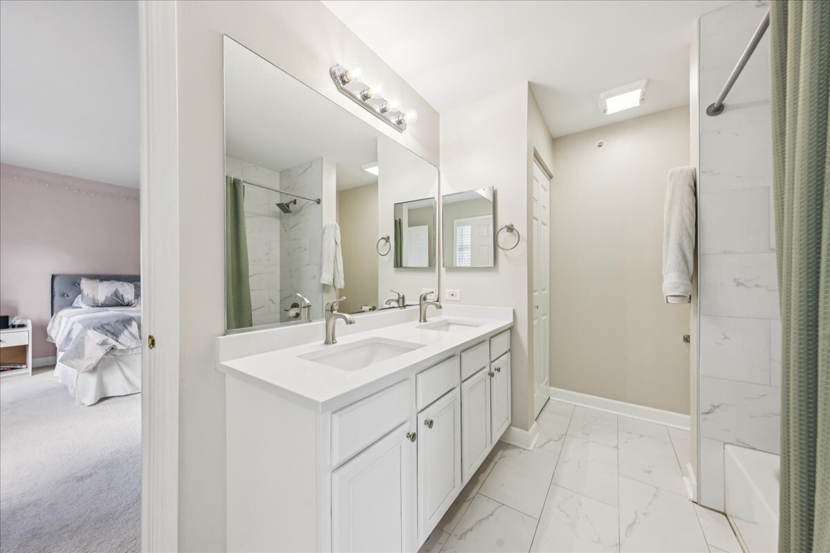 1432 Cascade Lane Barrington, IL 60010 - Photo 26 of 45 a bathroom with a double vanity sink mirror and shower