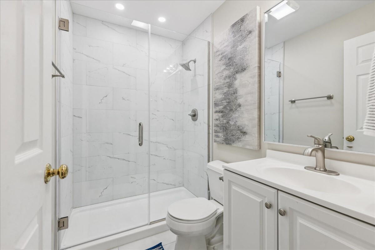 1432 Cascade Lane Barrington, IL 60010 - Photo 34 of 45 a bathroom with a sink a toilet and shower