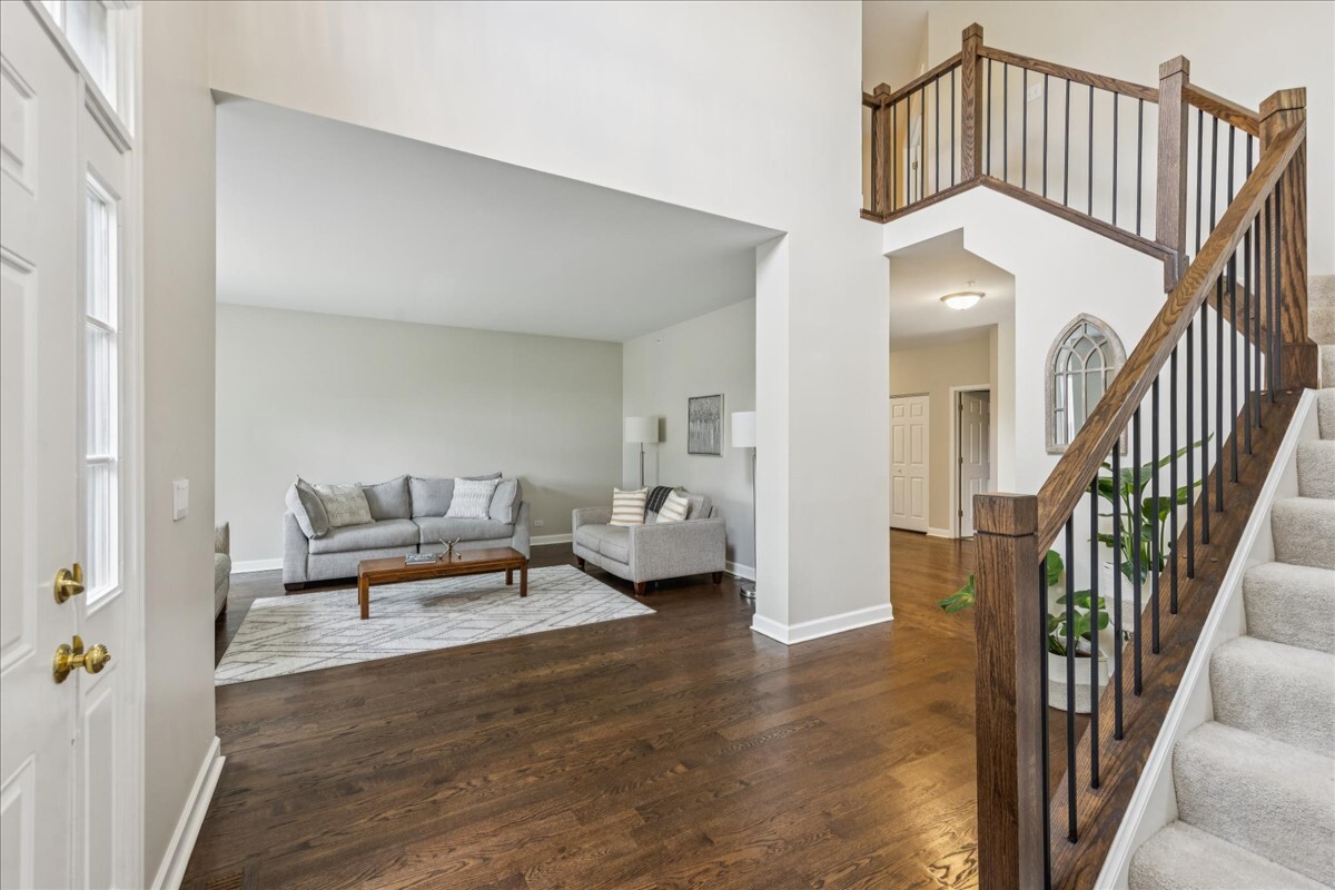 1432 Cascade Lane Barrington, IL 60010 - Photo 4 of 45 a view of a livingroom with furniture and staircase