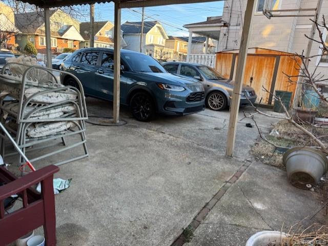 23-01 Enright Road Queens, NY 11691 - Photo 5 of 5 View of vehicle parking featuring a residential view