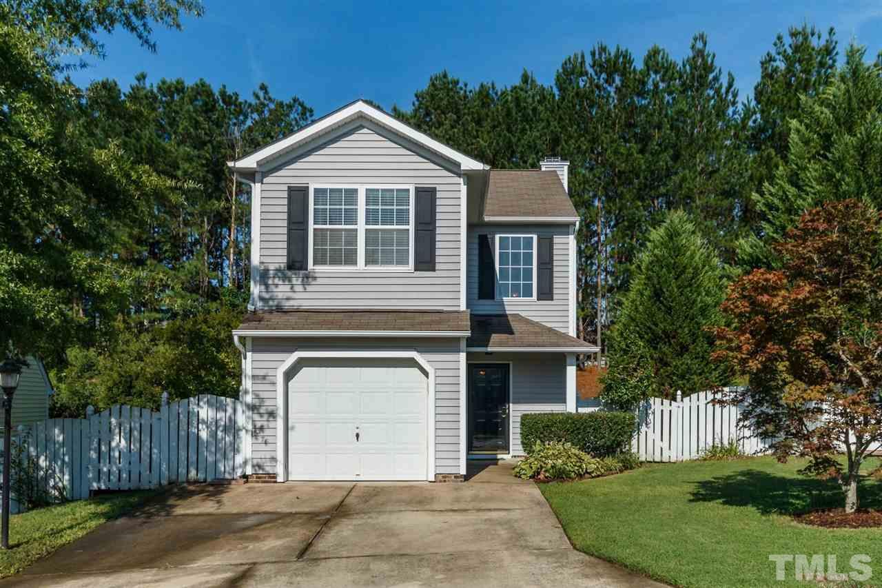5006 Gable Ridge Drive Durham, NC 27713 - Photo 1 of 24 a front view of a house with a garden