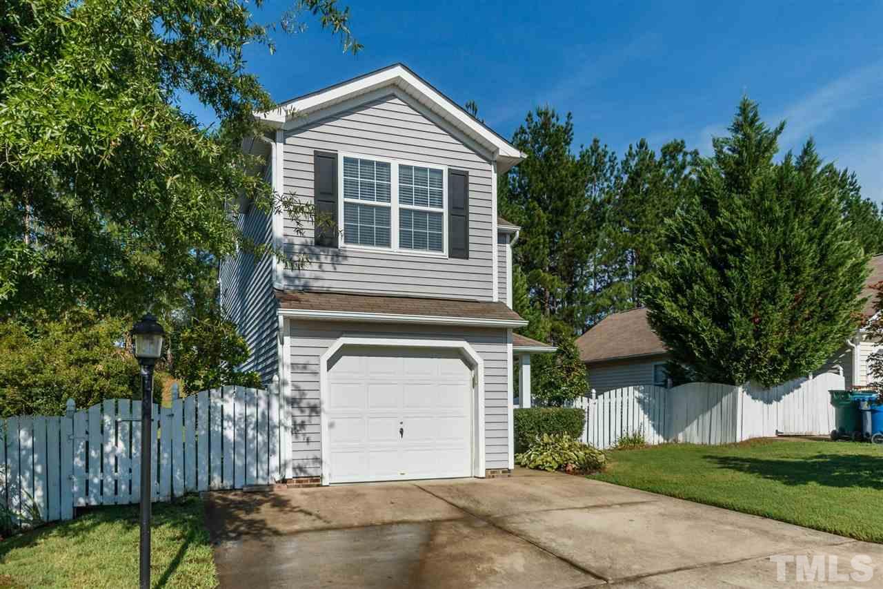 5006 Gable Ridge Drive Durham, NC 27713 - Photo 2 of 24 a front view of a house with a garden