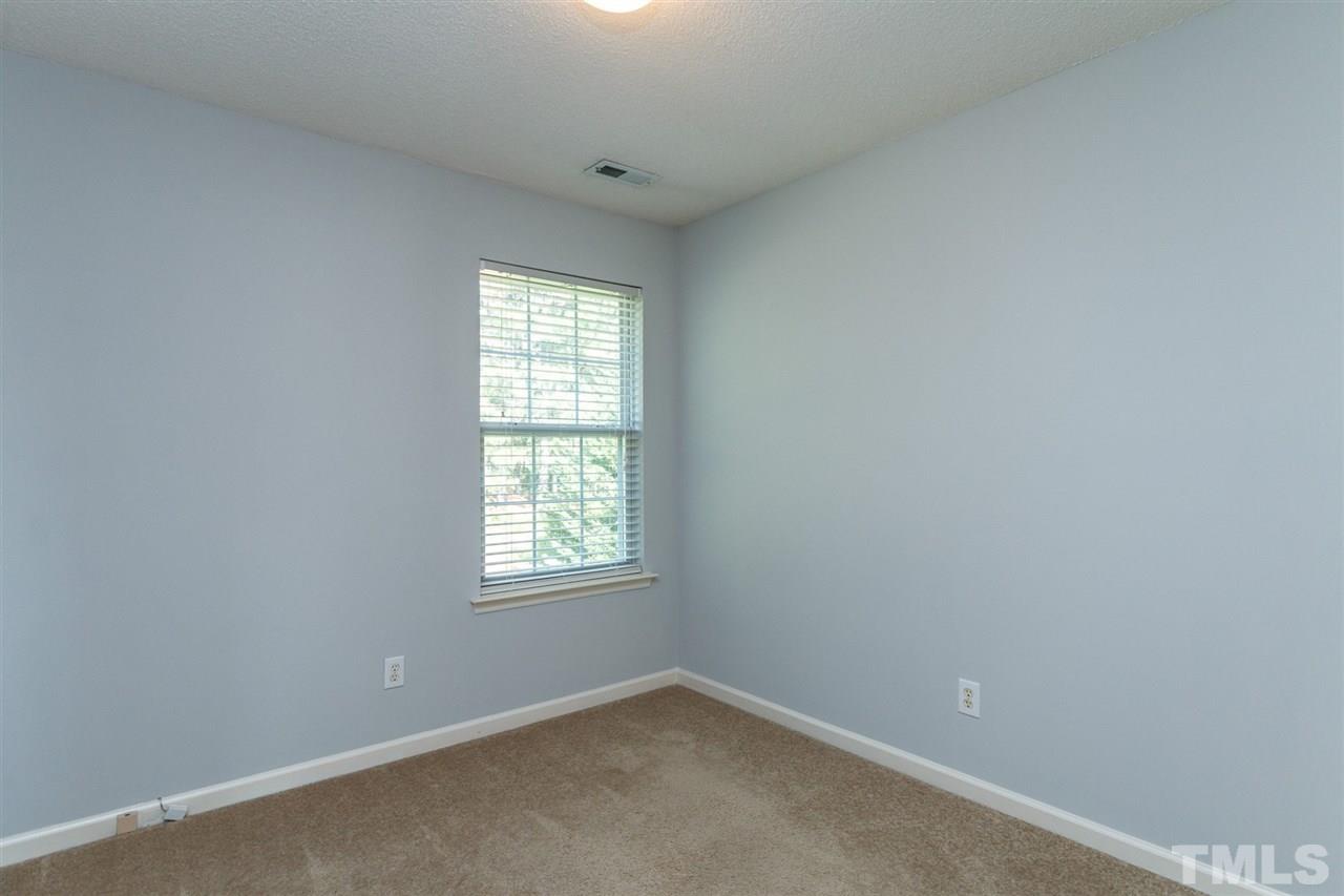 5006 Gable Ridge Drive Durham, NC 27713 - Photo 12 of 24 an empty room with a window