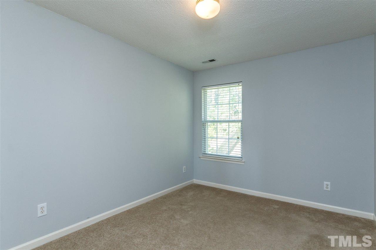 5006 Gable Ridge Drive Durham, NC 27713 - Photo 16 of 24 an empty room with windows