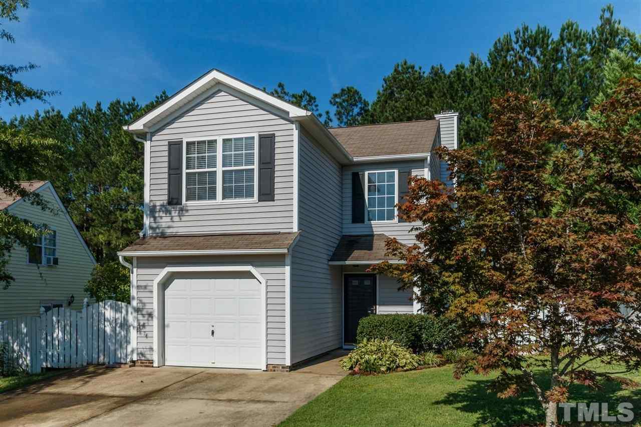 5006 Gable Ridge Drive Durham, NC 27713 - Photo 3 of 24 a front view of a house with a yard and garage
