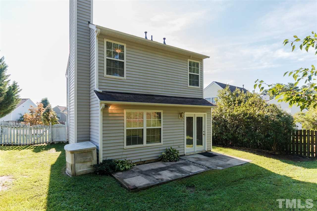 5006 Gable Ridge Drive Durham, NC 27713 - Photo 21 of 24 a view of a house with a yard and a garden