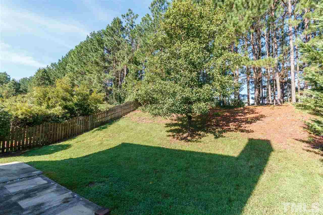 5006 Gable Ridge Drive Durham, NC 27713 - Photo 24 of 24 a view of a backyard with large trees