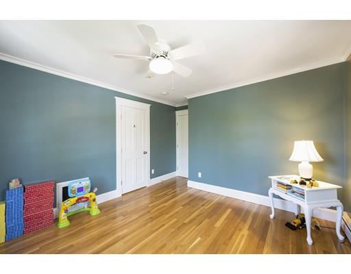 471 Chestnut Street Needham, MA 02492 - Photo 11 of 20 a bedroom with a bed and a chandelier