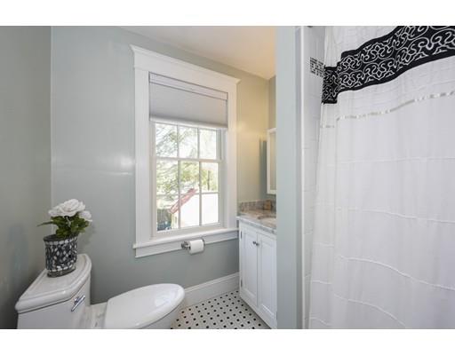 471 Chestnut Street Needham, MA 02492 - Photo 12 of 20 a bathroom with a sink toilet and window