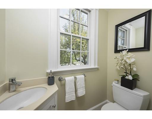 471 Chestnut Street Needham, MA 02492 - Photo 8 of 20 a bathroom with a bathtub sink and mirror