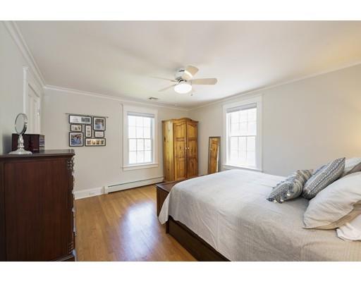 471 Chestnut Street Needham, MA 02492 - Photo 9 of 20 a bedroom with a bed and wooden floor
