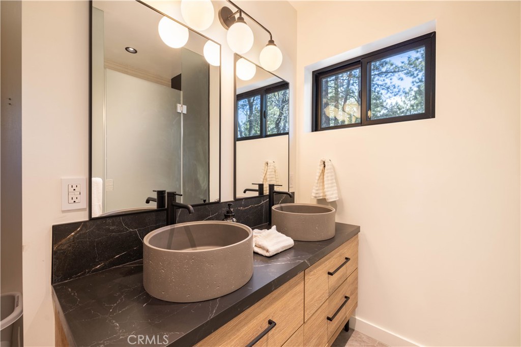 259 Victoria Sugarloaf, CA 92386 - Photo 20 of 32 a bath room with a sink and a mirror