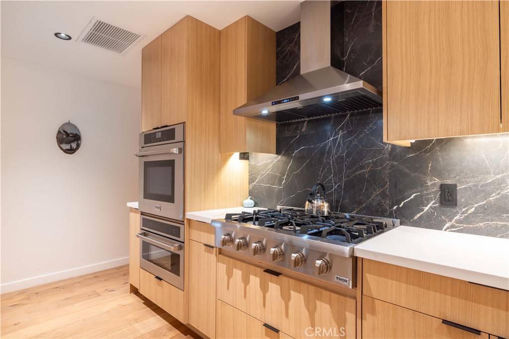 259 Victoria Sugarloaf, CA 92386 - Photo 9 of 32 a kitchen with a stove and a cabinet