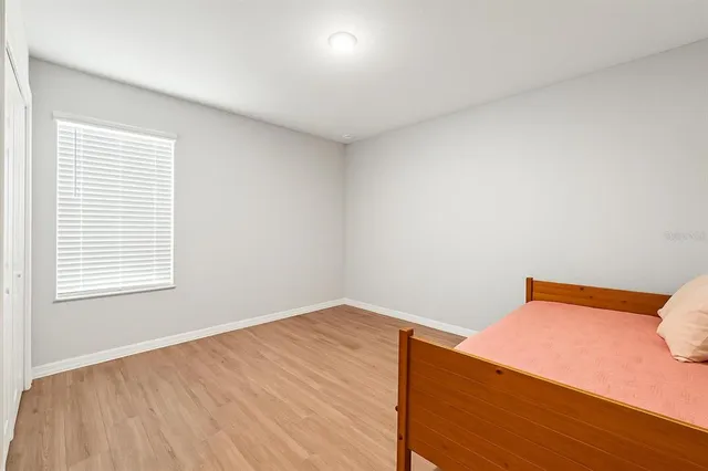 a view of workspace with furniture and wooden floor