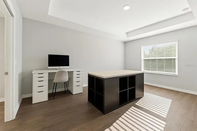 a kitchen that has a table and chairs in it