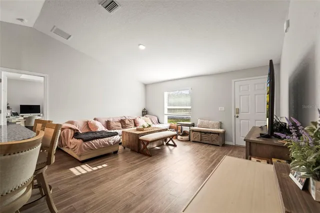 a living room with furniture and a window