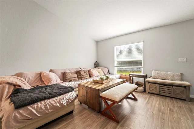 a bedroom with two beds and a flat screen tv