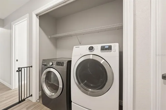 a view of a storage and utility room with closet