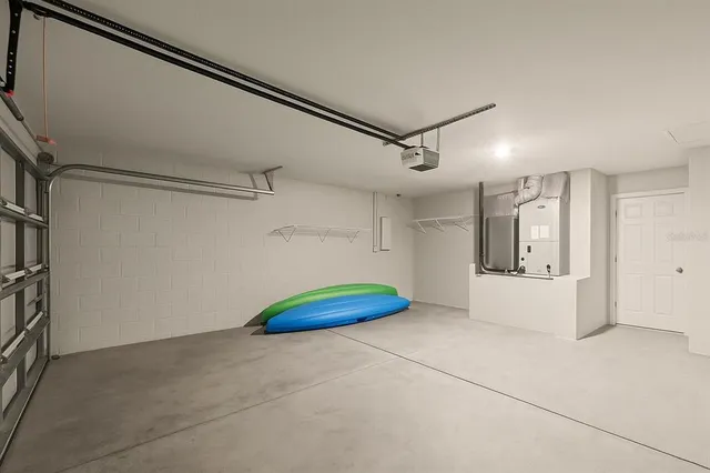 a front view of a house with potted plants