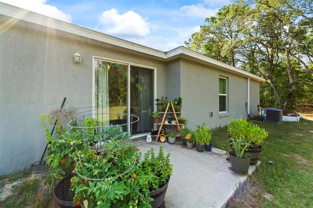 a wooden bench sitting in backyard of house