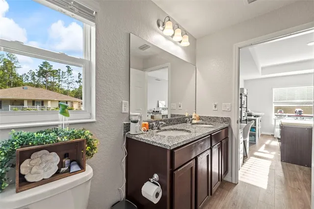 a kitchen with a stove a sink and a refrigerator