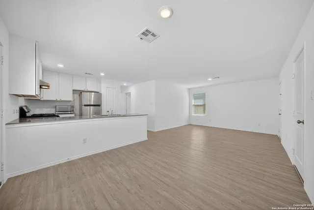 a view of kitchen with wooden floor