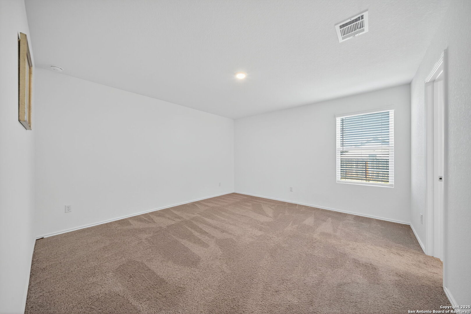 12935 Deep Eddy St. Hedwig, TX 78152 - Photo 18 of 26 a view of an empty room with a window