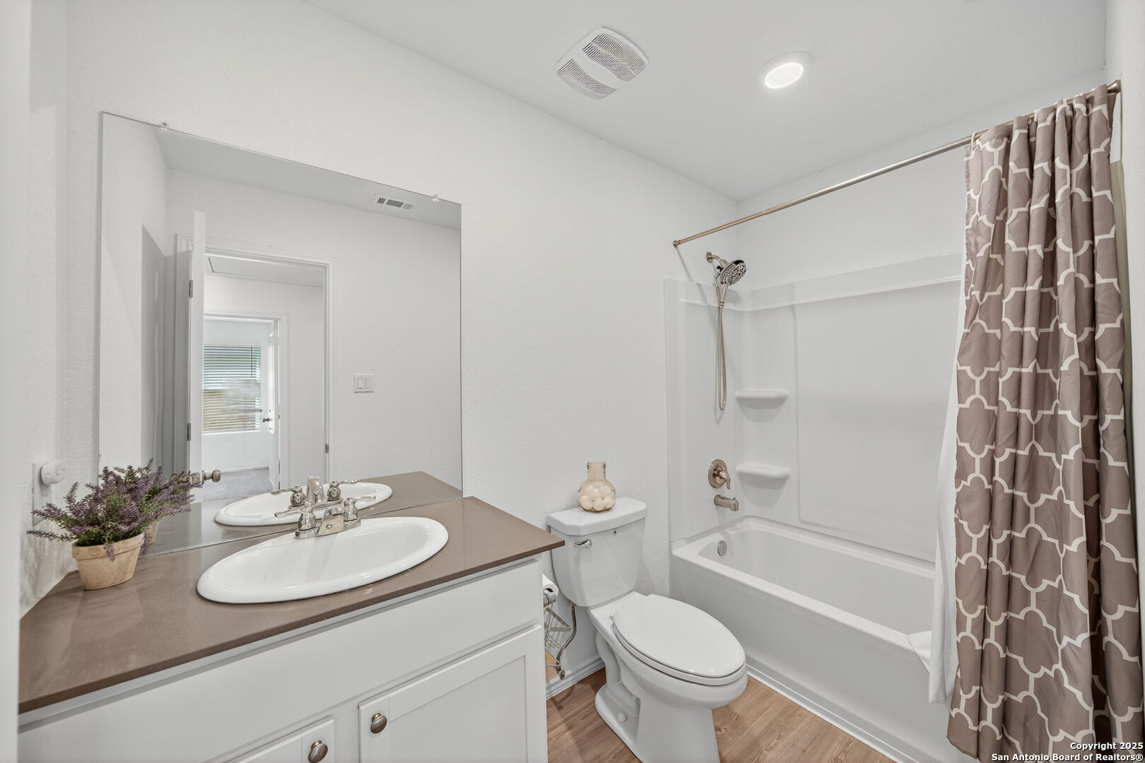 12935 Deep Eddy St. Hedwig, TX 78152 - Photo 22 of 26 a bathroom with a sink toilet and shower